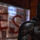 Batman standing with the word LIES behind him.